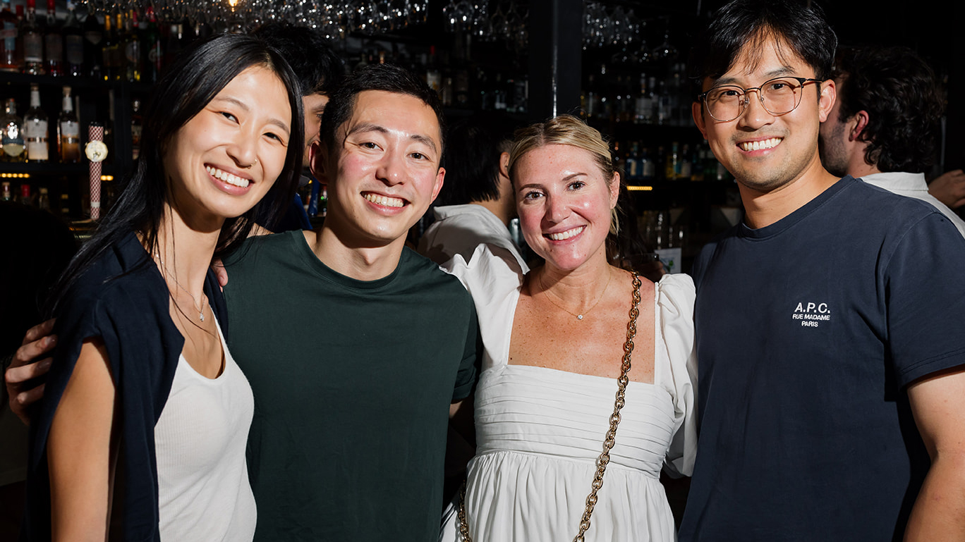 Four smiling Valon teammates together at a team event